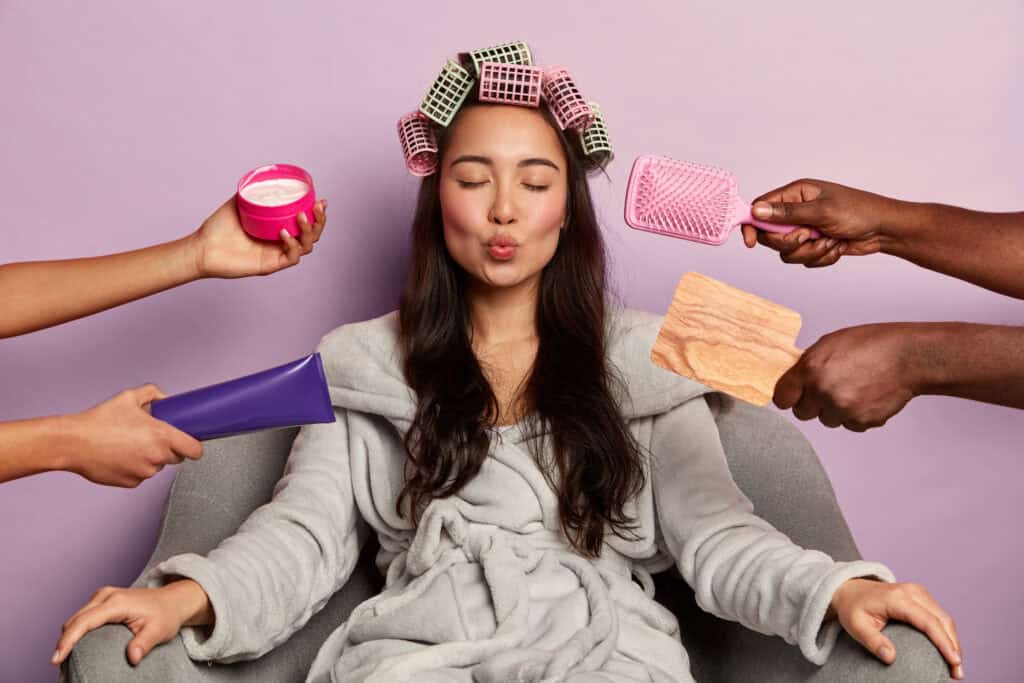 self care tips   a woman sitting in a chair with her eyes closed and several objects around her