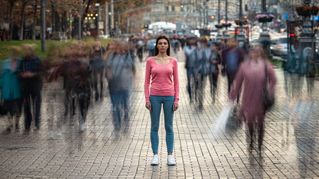 The young girl stands on the crowded urban street Acceptance Path paradoxical mindfulness benefits acceptance path