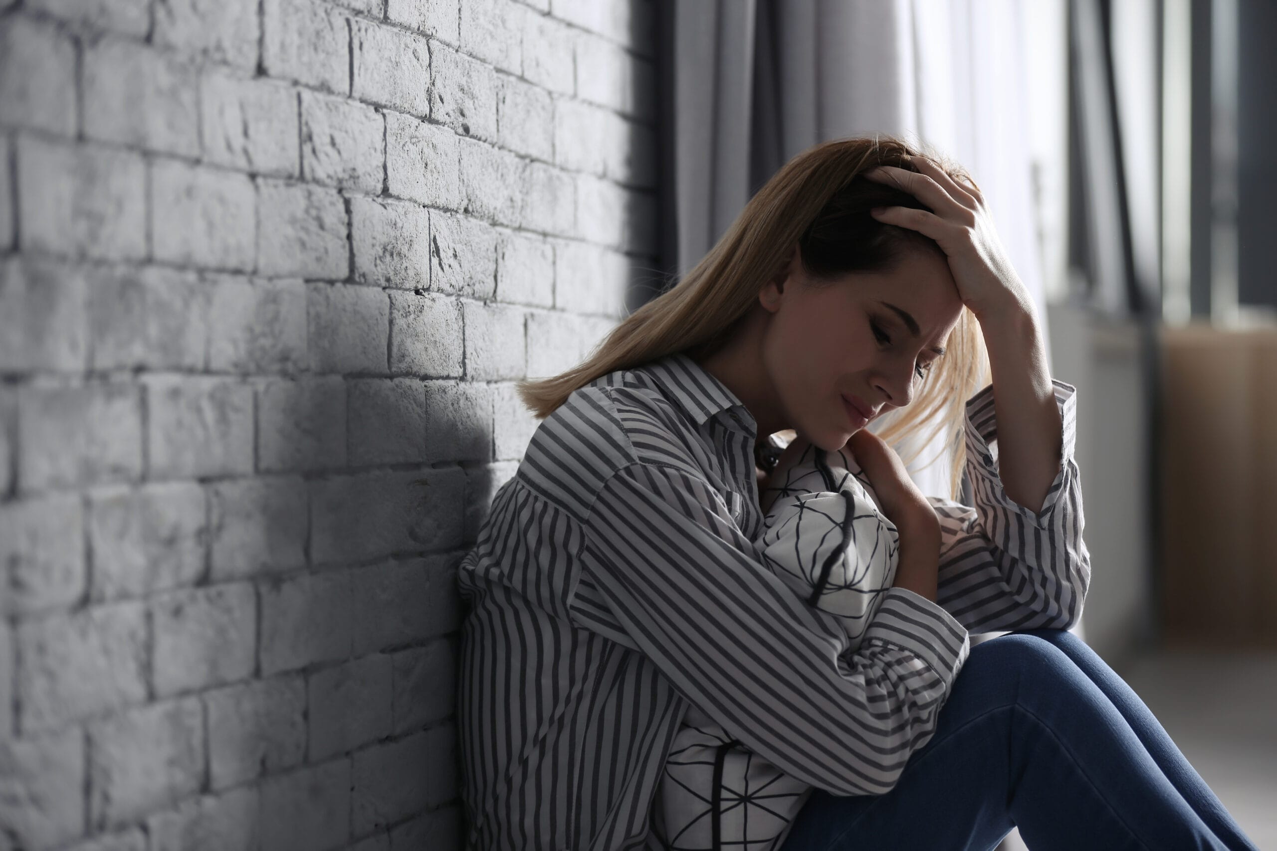 Lonely woman suffering from depression at home Acceptance Path Counseling Woman in Louetta experiencing the biological stalemate of anxiety vs depression Acceptance Path Counseling