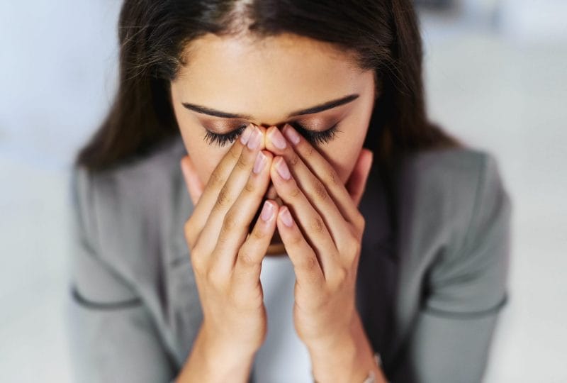 Professional woman in Louetta struggling with anxiety vs depression Acceptance Path Counseling.